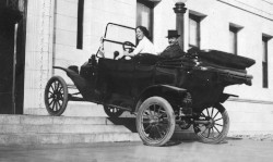 Historical photo of people in a car